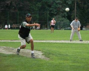 Gary Eng, Summit Customs Brokers operational manager, delivers a slow pitch at the Rubina Hope for Kids Softball Slam fundraising event, which raised a record $16,550.