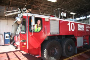 Anna Burk, who will serve as one of this year’s airport tour guides for Grade 5 students, gets a close-up look at YVR’s fire truck.