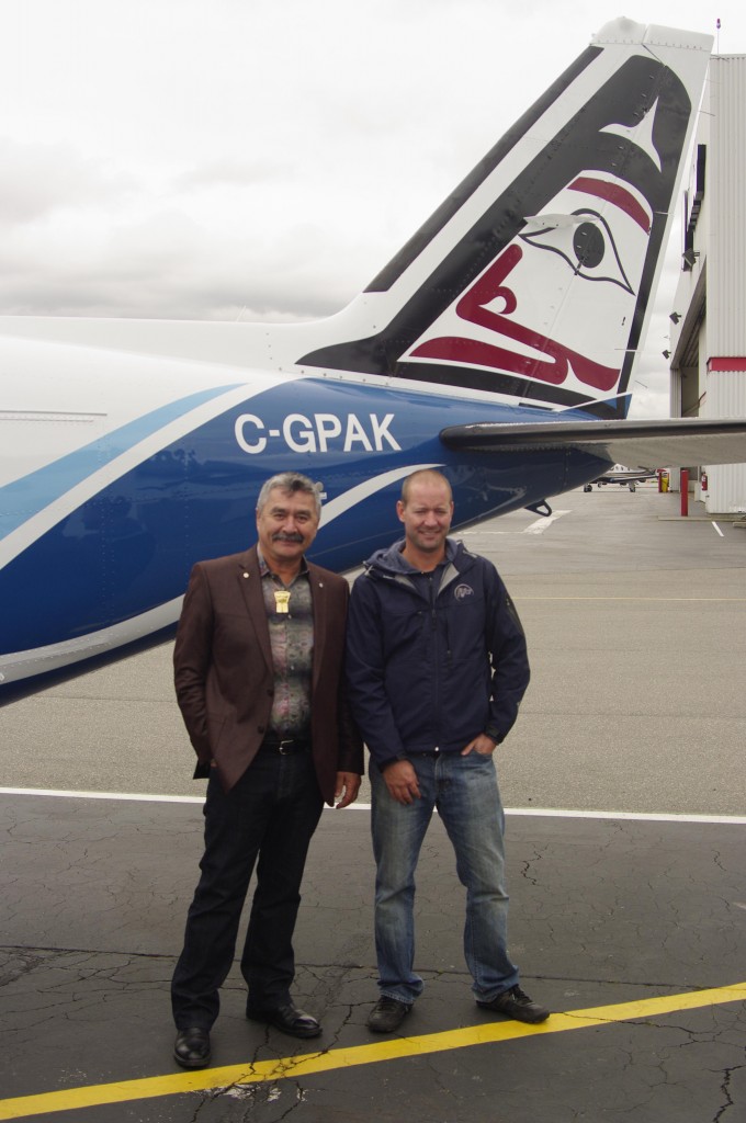 Artist Roy Henry Vickers (left) and Orca Airways president and CEO Andrew Naysmith with the newly updated Navajo Chieftain that features Vickers’ original art design. Photo: Orca Airways.