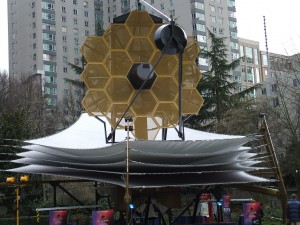 A model of the James Webb Telescope—a project of NASA, with international collaboration from the European Space Agency and the Canadian Space Agency, including contributions from 15 nations, it is estimated to be completed by 2018 at a cost of $8-billion.