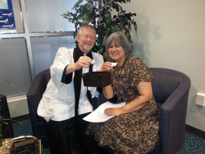 Chaplaincy asssociate, the Rev. Jim Krawchuk presents draw winner Audrey with a Mother's Day gift pack.