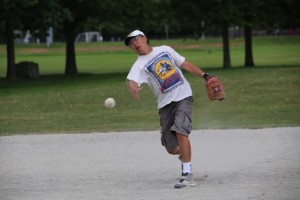 Gary Eng, general manager, Summit Customs Brokers, throws a slo-pitch.