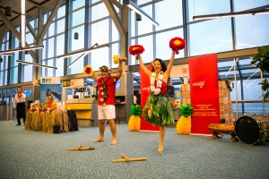 Hawaiian-themed dancers welcome Air Canada rouge new year-round non-stop service between YVR and Honolulu.