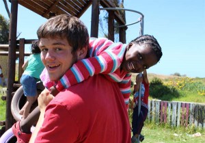 A Projects Abroad volunteer and a local child during playtime at a Care placement in Cape Town, South Africa. 